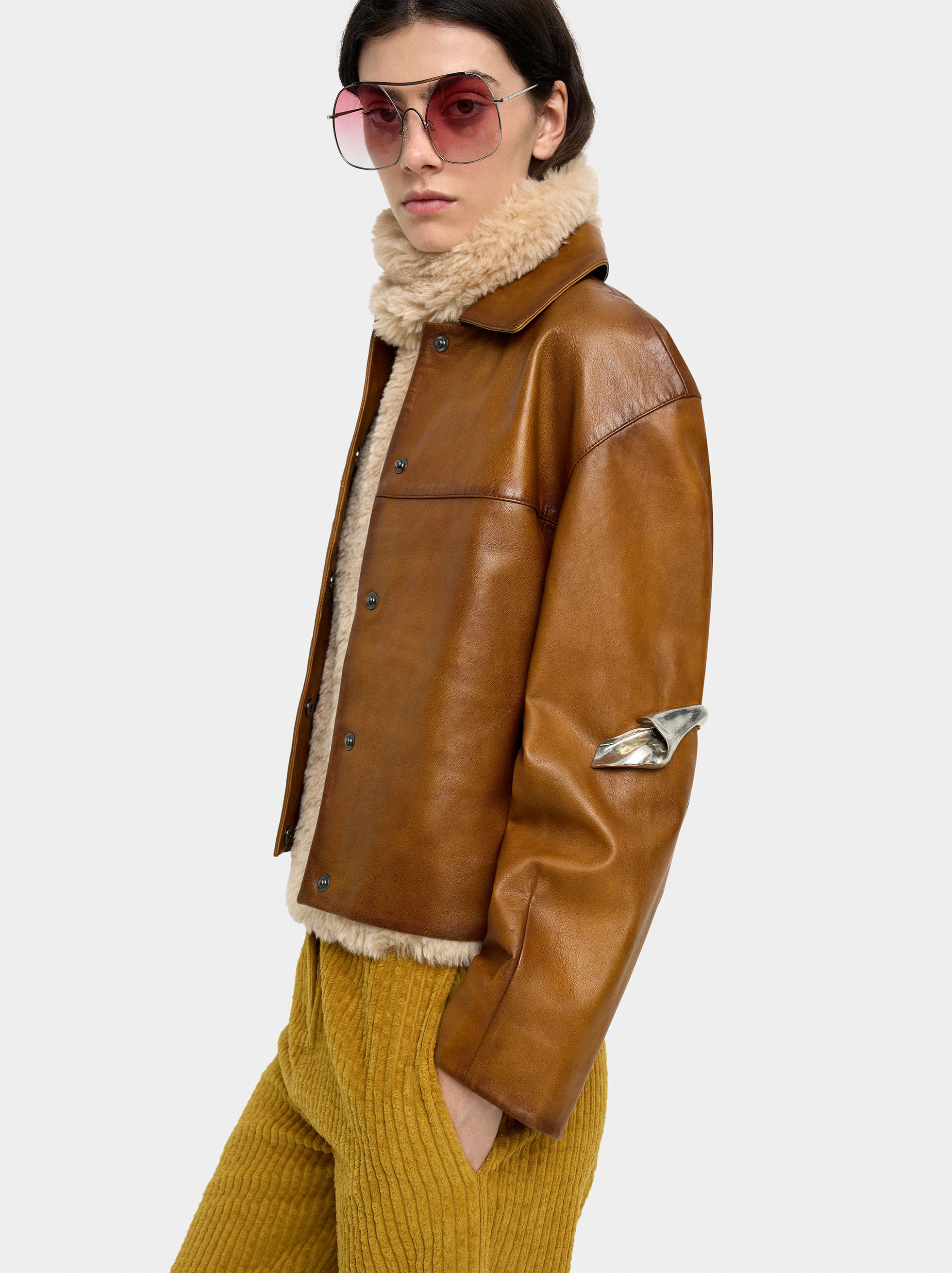 Manteau en fourrure à surpiqués